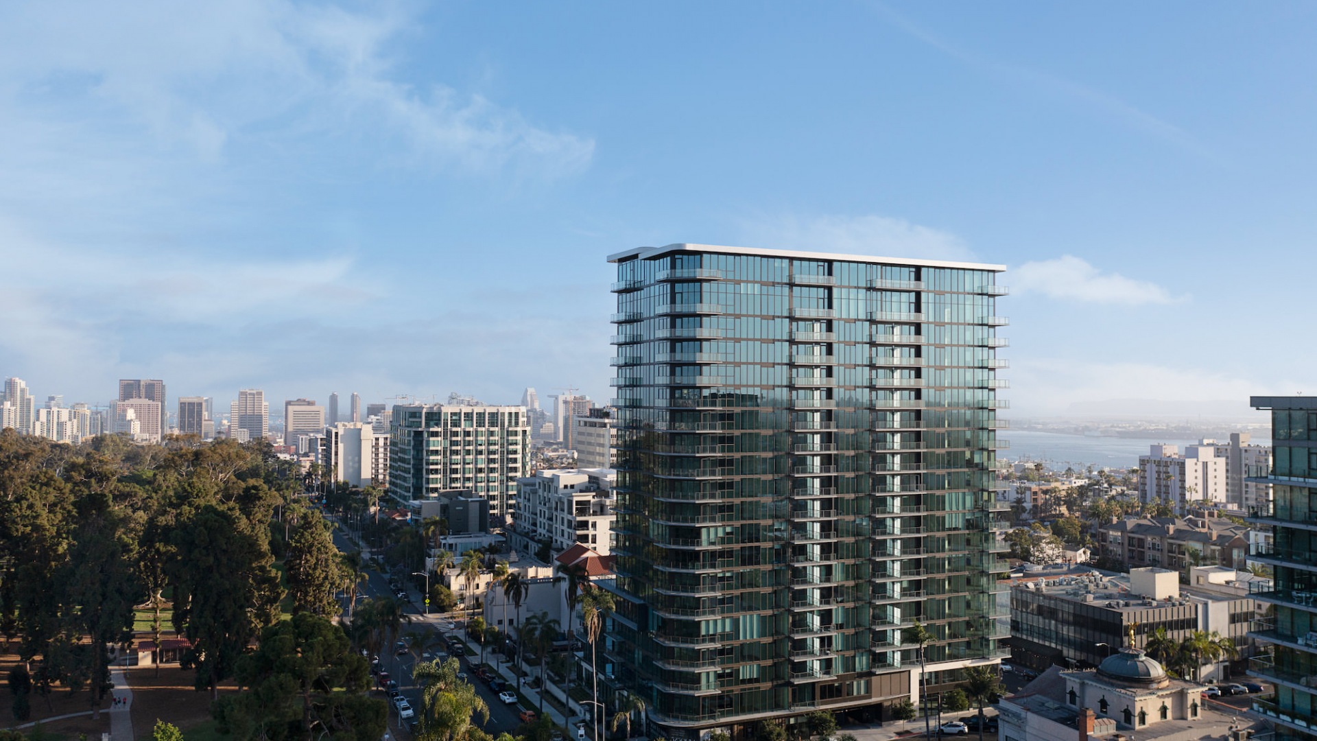 Exterior view of 525 Olive with downtown San Diego and water in the background